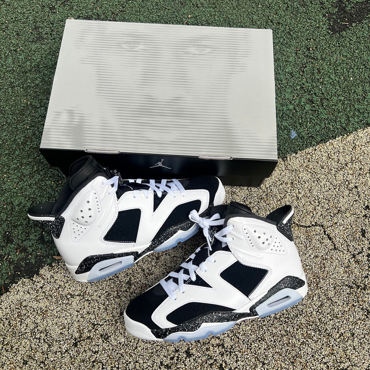 Nike Air Jordan 6 Retro Oreo sneakers in black and white with a sleek design, featuring the classic Jordan branding.