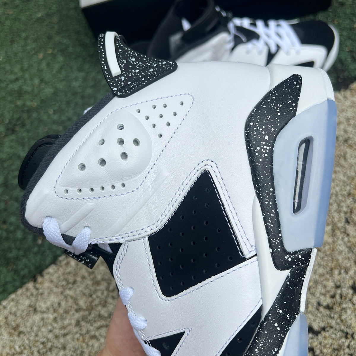 Nike Air Jordan 6 Retro Oreo sneakers in black and white with a sleek design, showcasing the classic Jordan style and branding.