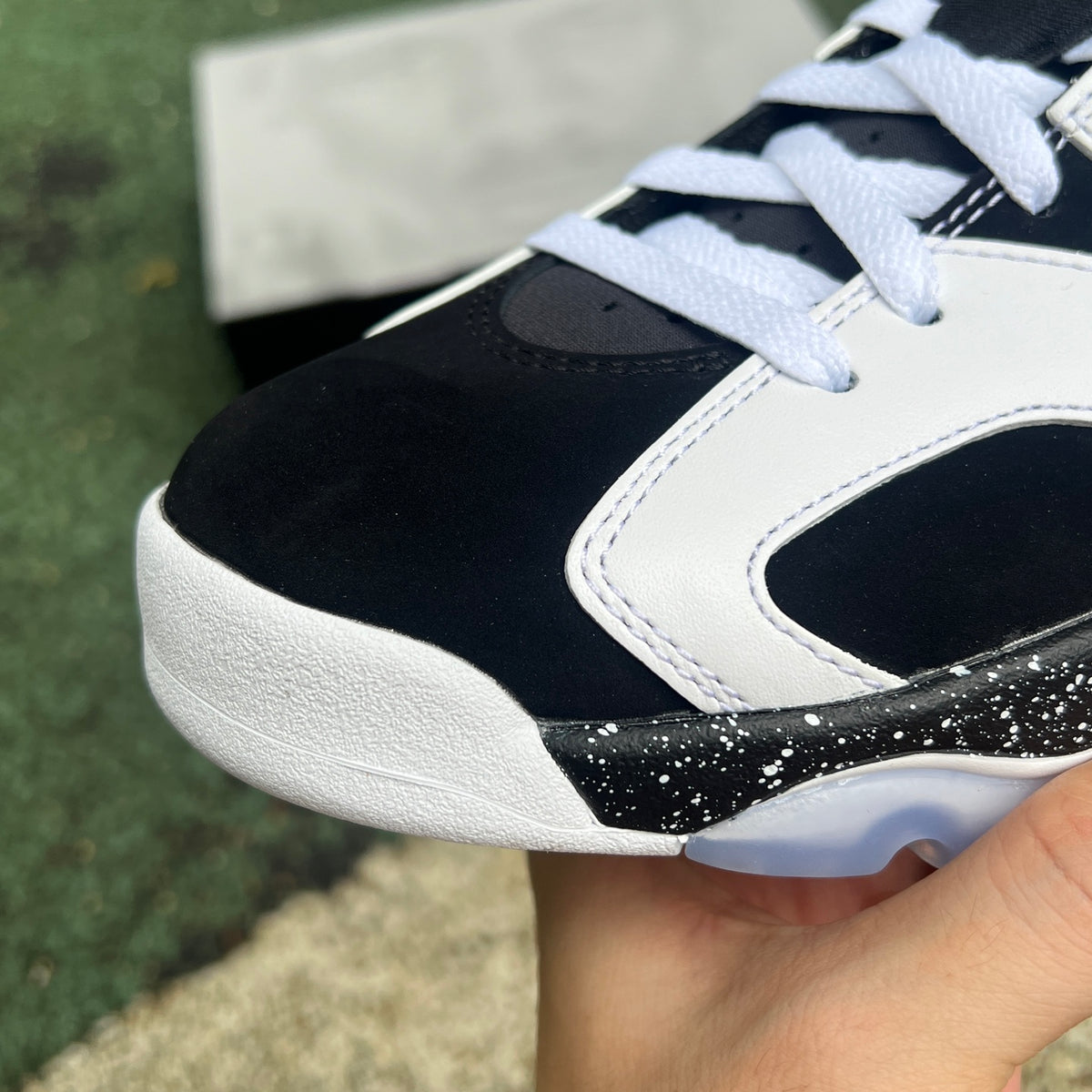 Nike Air Jordan 6 Retro Oreo sneakers in black and white with icy blue accents, displayed on a white background.