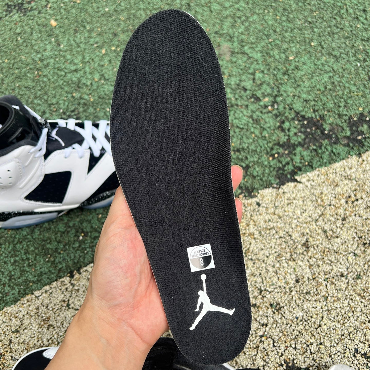 Nike Air Jordan 6 Retro Oreo sneakers in black and white with a sleek design and detailed branding.
