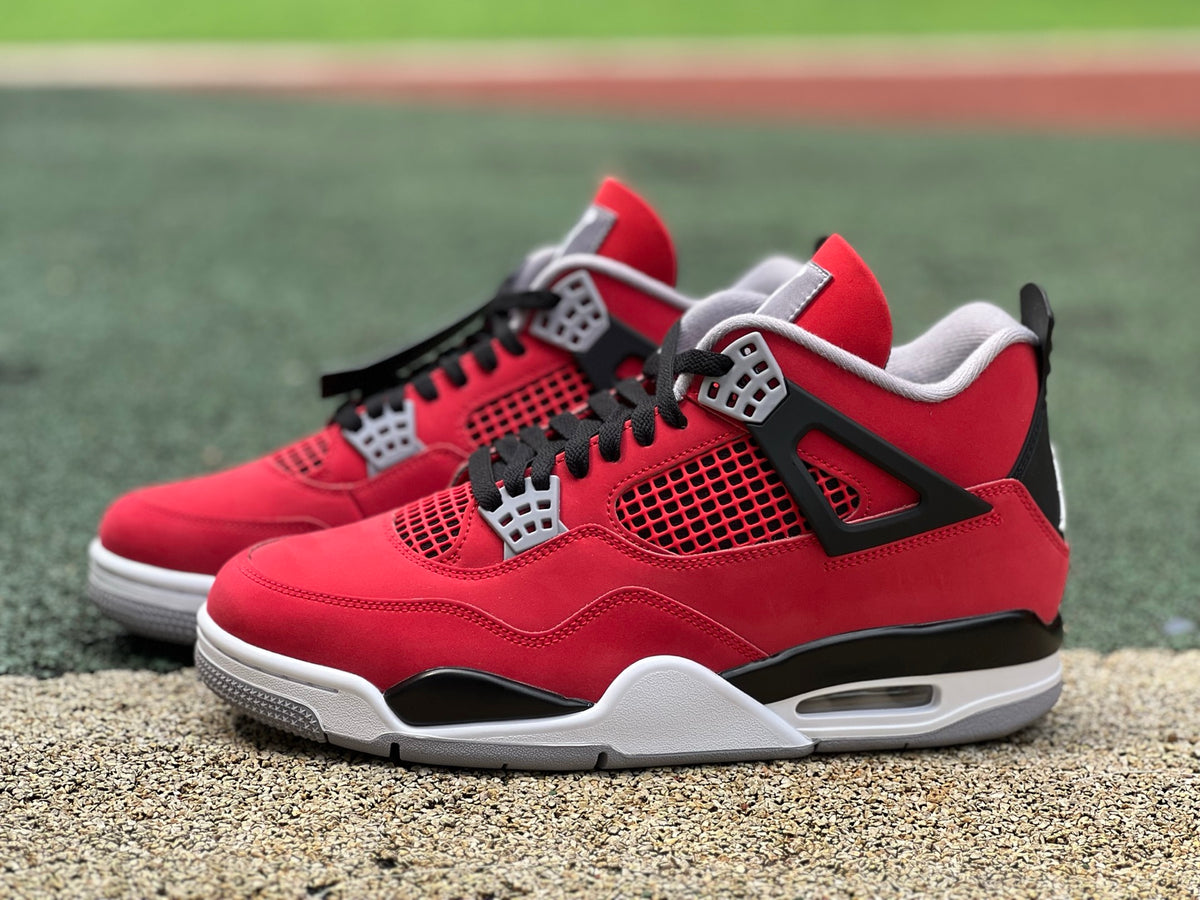 Nike Air Jordan 4 Retro Toro Bravo sneaker in red and black with white accents, showcasing the classic basketball shoe design.