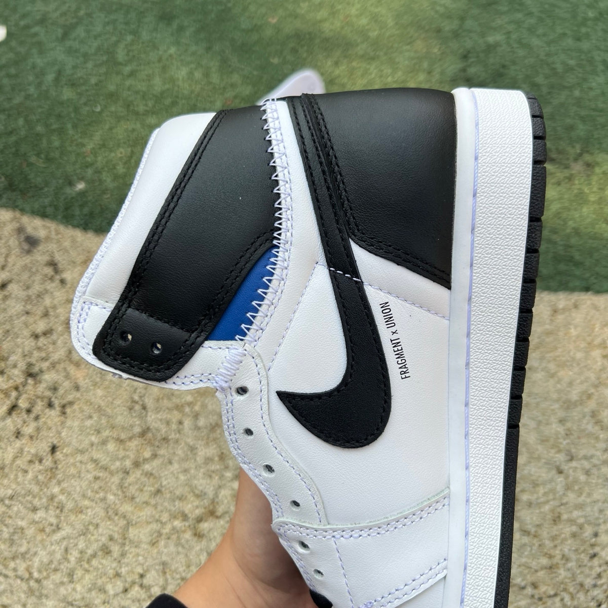Nike Air Jordan 1 Retro High OG SP Fragment x Union LA sneakers with white, black, and gray leather, detailed close-up shot