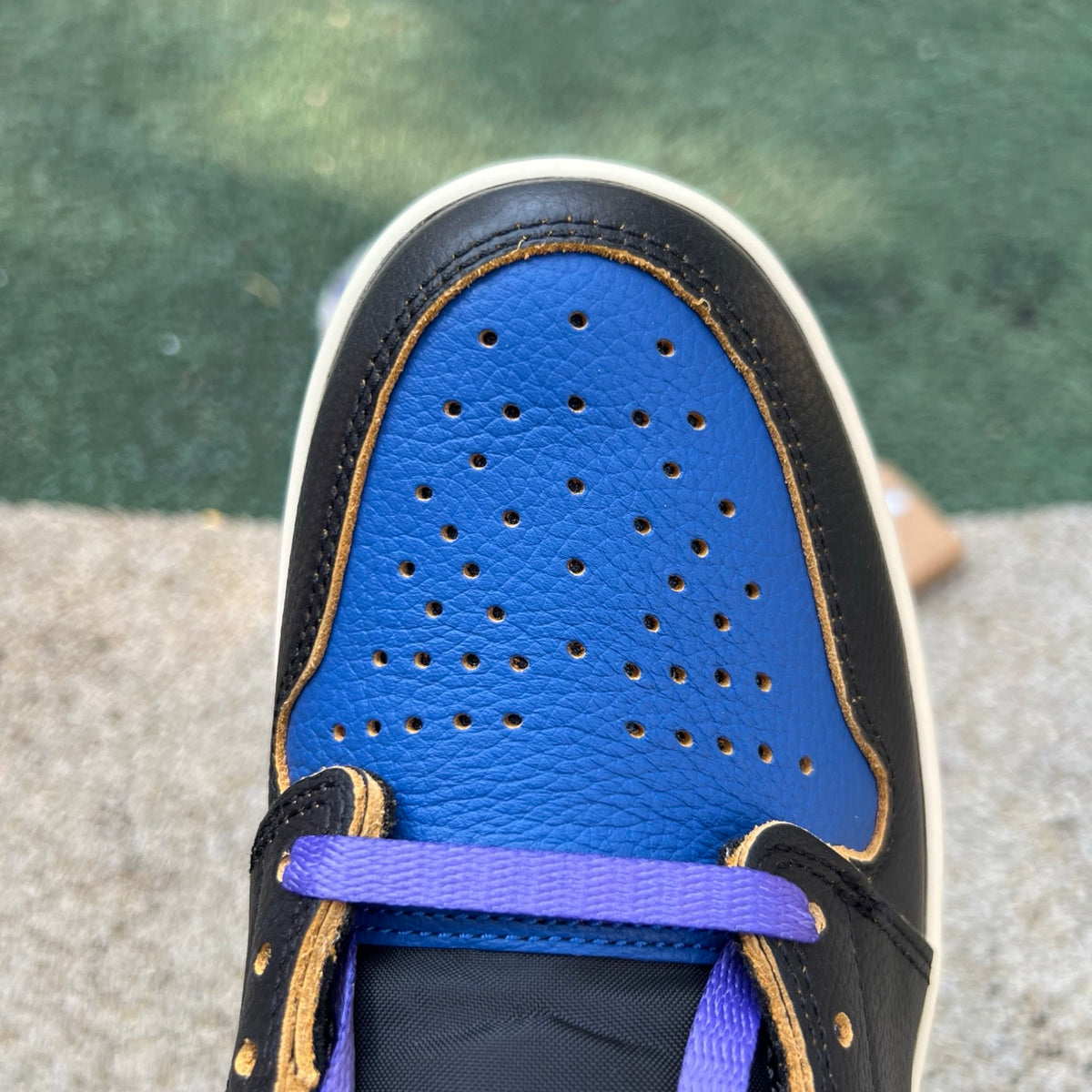 Nike Air Jordan 1 Retro High OG SP Fragment x Union LA sneaker in Royal with blue and white colorway, front view showing design details