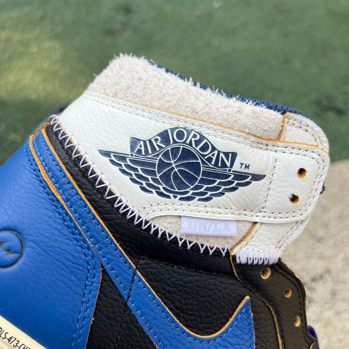 Nike Air Jordan 1 Retro High OG SP Fragment x Union LA sneakers in Royal blue, featuring a high-top design and iconic branding.