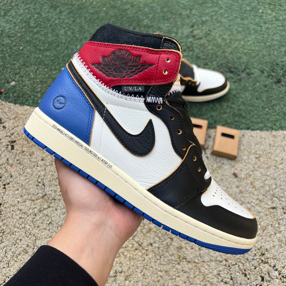 Nike Air Jordan 1 Retro High OG SP Fragment x Union LA sneakers in Varsity Red and Sport Royal with Nike and Jordan branding.