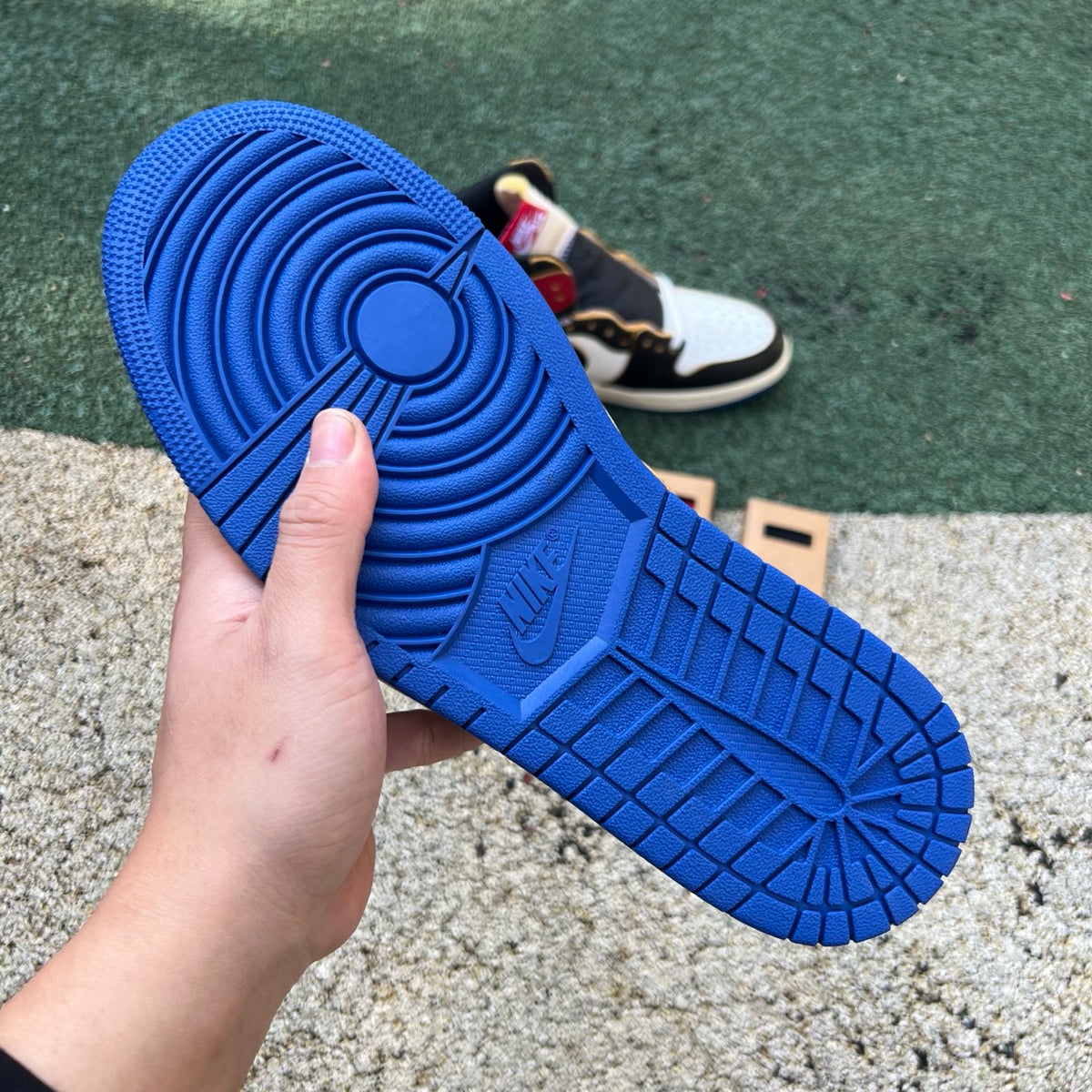Nike Air Jordan 1 Retro High OG SP Fragment x Union LA sneakers in Varsity Red and Royal blue, featuring high-top design and Nike Jordan branding.