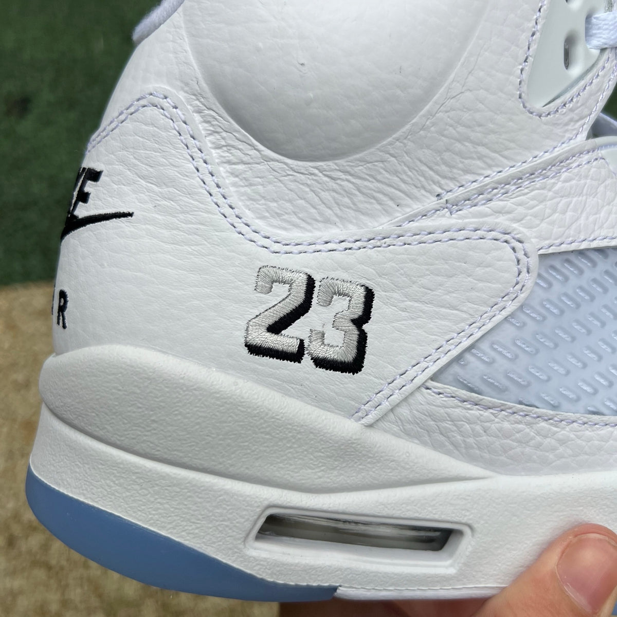 Nike Air Jordan 5 Retro White Metallic sneakers with black accents, showcasing the classic design and premium materials.