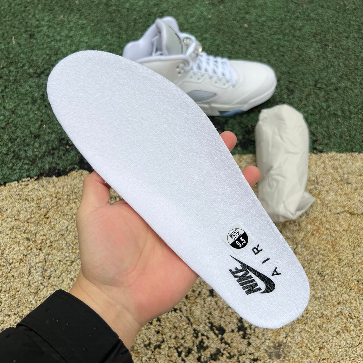 Nike Air Jordan 5 Retro White Metallic sneakers with white and metallic silver design, showcasing the classic basketball shoe style.