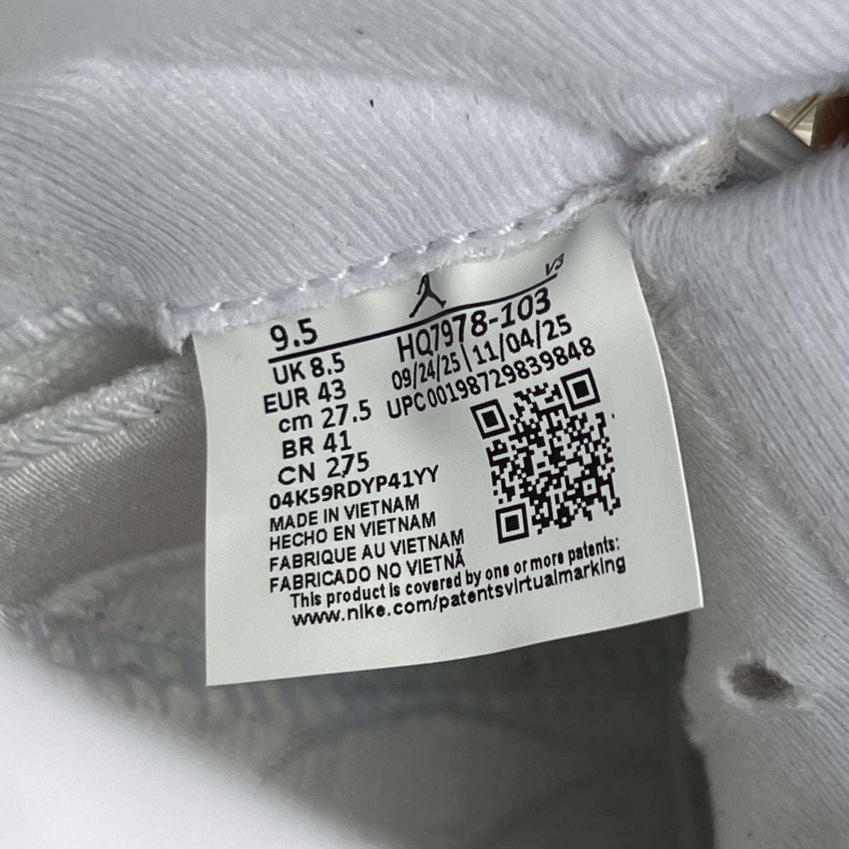 Nike Air Jordan 5 Retro White Metallic sneakers with black accents, showcasing the classic design and premium materials.