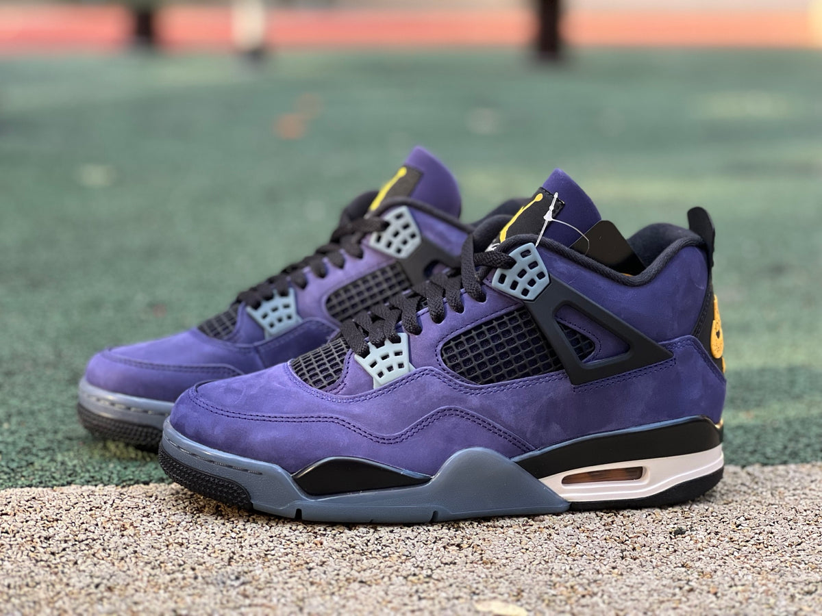 Nike Air Jordan 4 Retro Lakers sneakers in purple and yellow with white accents, showcasing the iconic basketball shoe design.