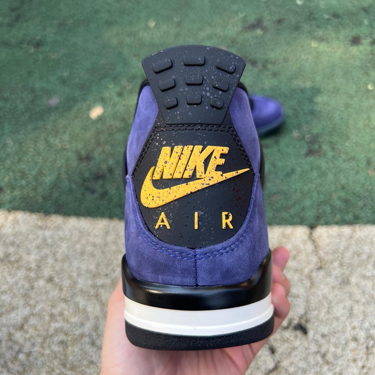 Nike Air Jordan 4 Retro Lakers sneakers in purple and gold, showcasing the iconic basketball shoe design by Nike x Jordan