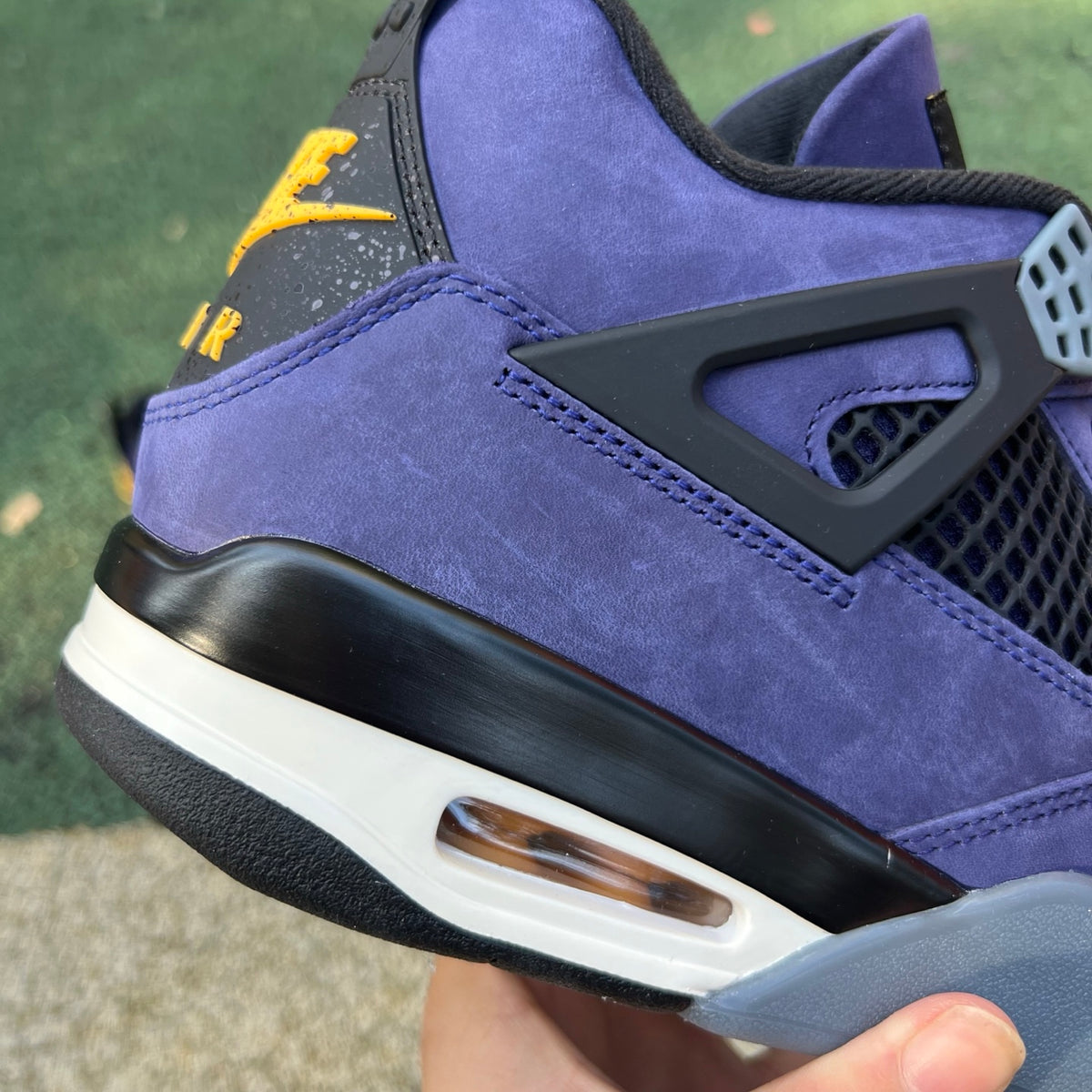 Nike Air Jordan 4 Retro Lakers sneakers, blue and gold colorway, featuring iconic design and signature Jordan branding.