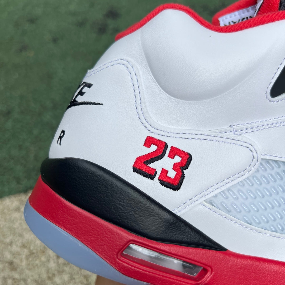 Nike Air Jordan 5 Retro Fire Red and black sneakers with a high-quality finish and iconic design, featuring a prominent tongue.