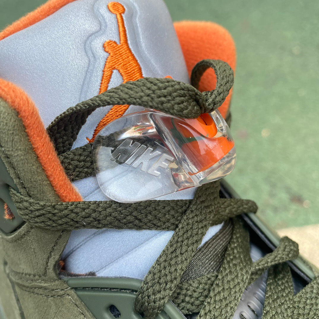 Nike Air Jordan 5 Retro Olive sneakers by Nike x Jordan, featuring the classic design with olive green accents and stylish detailing