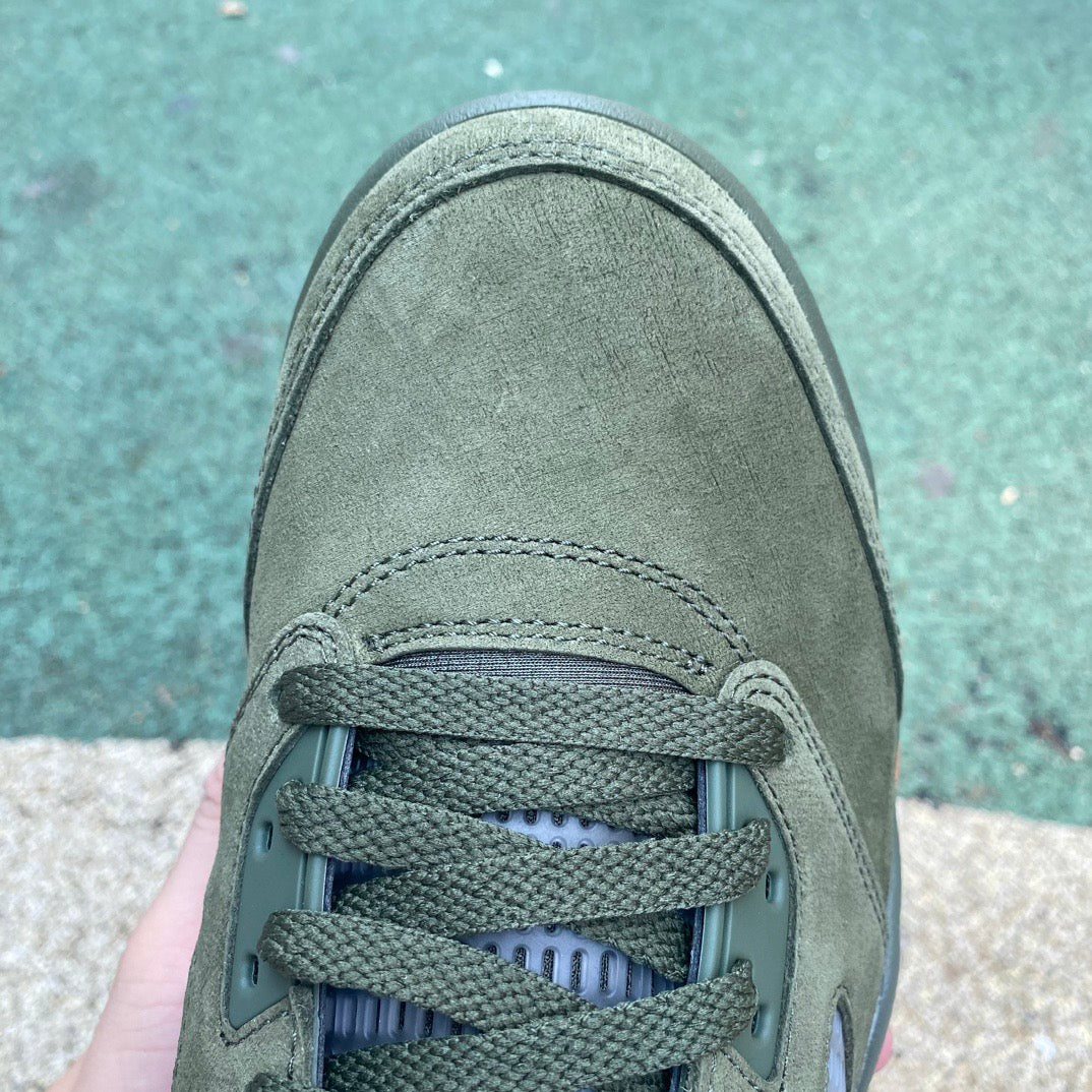 Nike Air Jordan 5 Retro Olive sneakers in green and black with detailed design and signature Jordan branding.