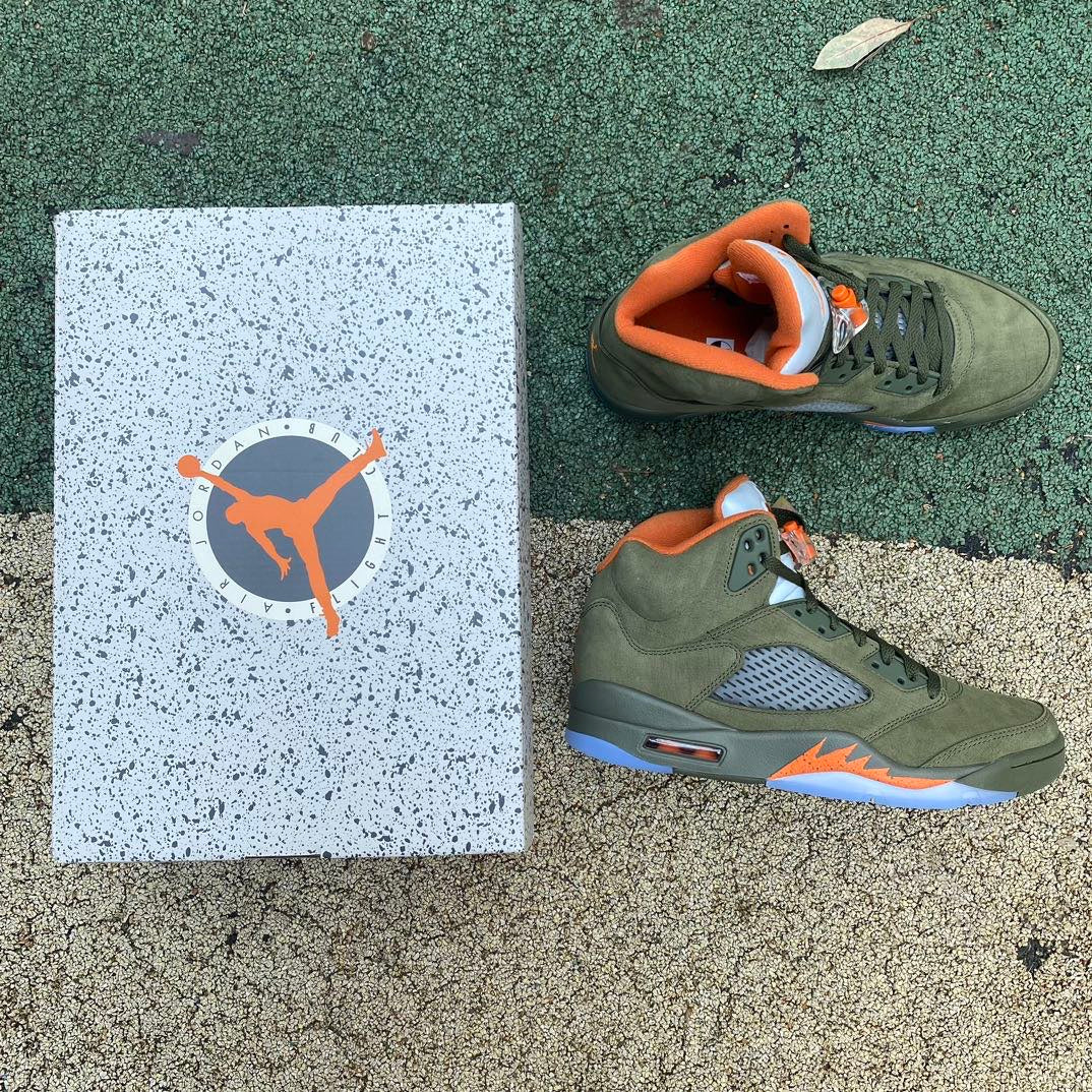 Nike Air Jordan 5 Retro Olive sneakers in a close-up view, showcasing the olive green colorway and detailed design.