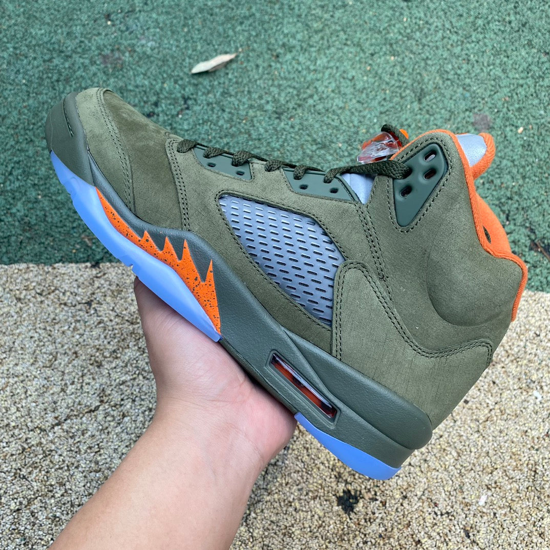 Nike Air Jordan 5 Retro Olive sneakers featuring a sleek design and olive green accents, styled for modern athletic wear
