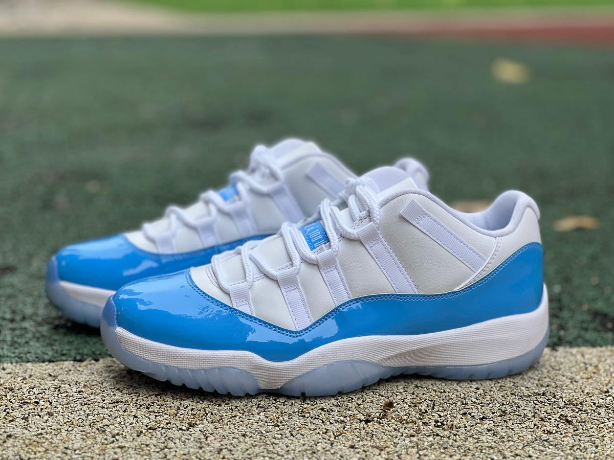 Nike Air Jordan 11 Retro Low University Blue sneakers, featuring sleek design and signature blue colorway, on a white background.