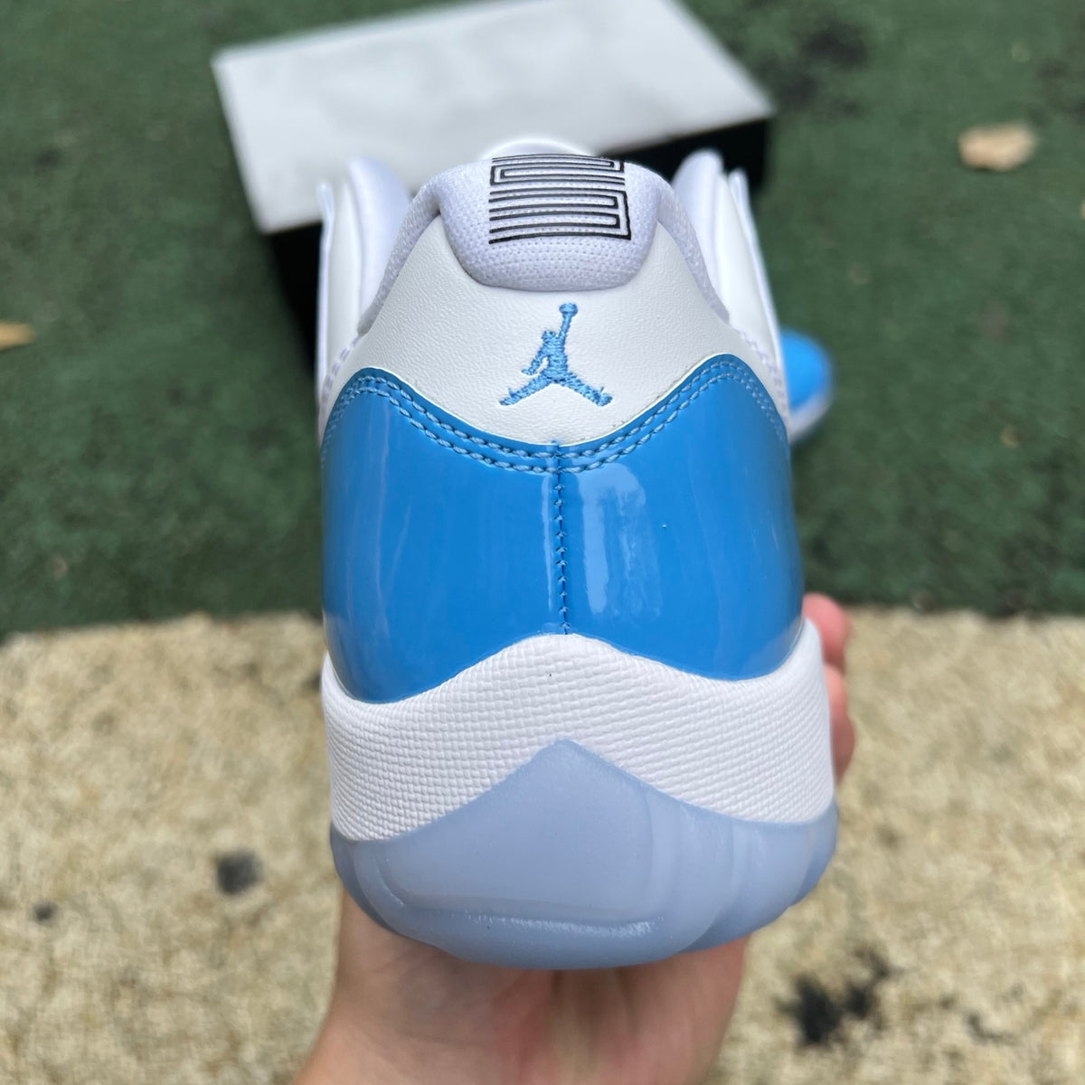 Nike Air Jordan 11 Retro Low University Blue sneakers in a side view, showcasing the iconic blue and white colorway.