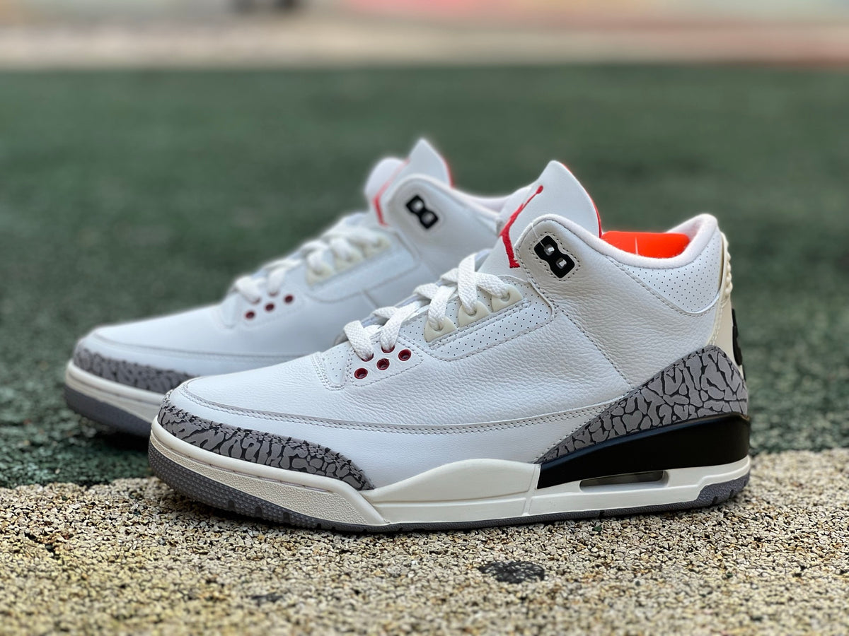 Nike Air Jordan 3 Retro White Cement Reimagined kids' sneaker featuring white leather, grey accents, and signature Jordan heel logo.