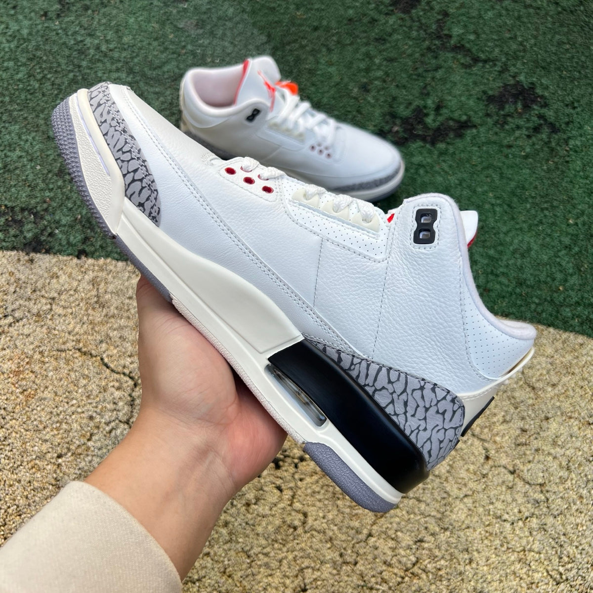 Nike Air Jordan 3 Retro White Cement Reimagined kids' sneakers with white and gray leather and signature design details.