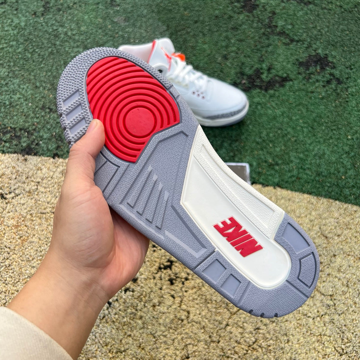 Nike Air Jordan 3 Retro White Cement Reimagined kids' sneaker featuring white leather, grey accents, and signature Nike branding.