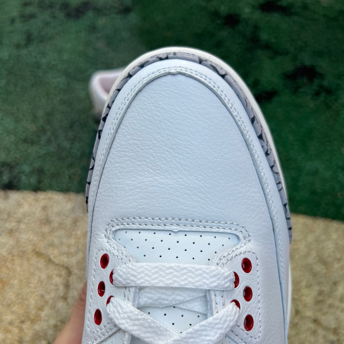 Nike Air Jordan 3 Retro White Cement Reimagined sneakers in size GS, featuring white leather and cement gray accents.