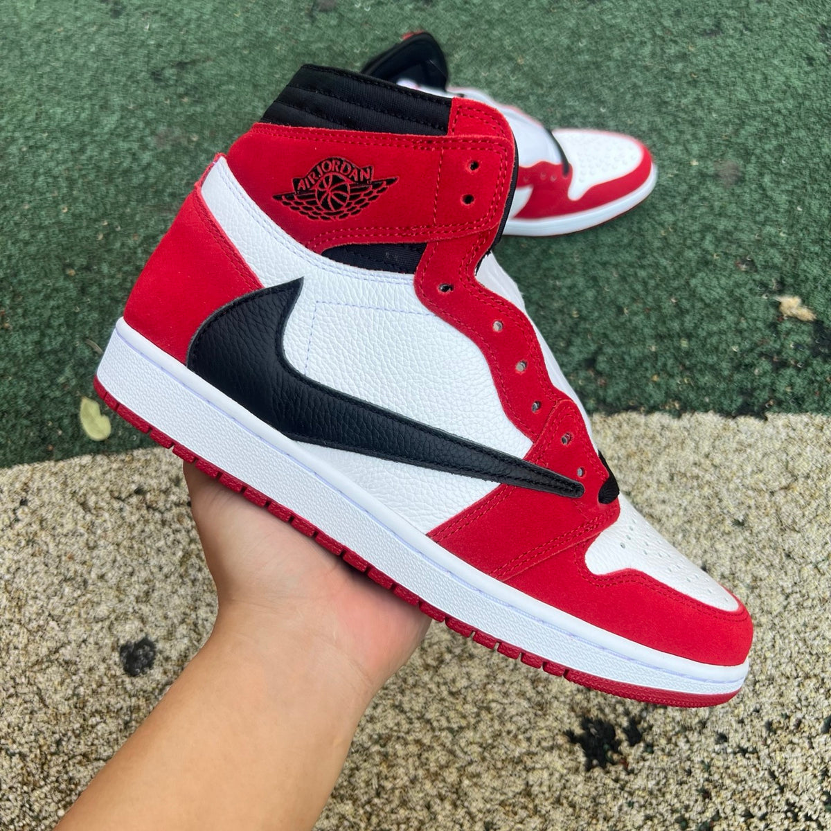 Nike Air Jordan 1 Retro High OG SP Fragment x Travis Scott sneakers displayed, featuring iconic design and collaboration details
