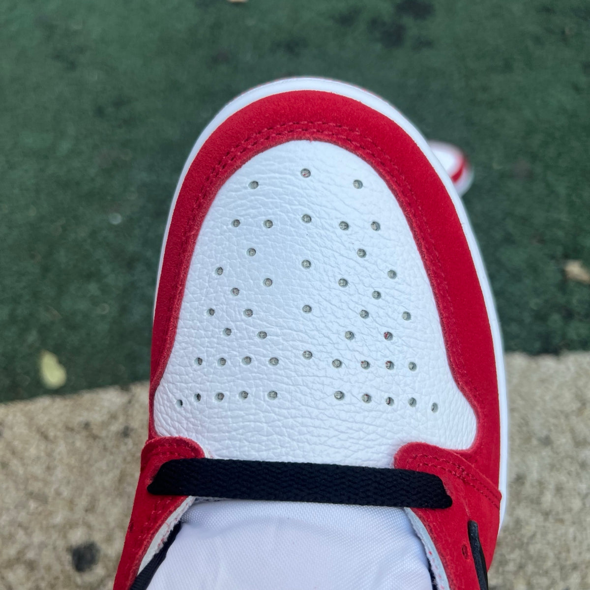 Nike Air Jordan 1 Retro High OG SP Fragment x Travis Scott sneakers in white and brown with Nike and Jordan branding.