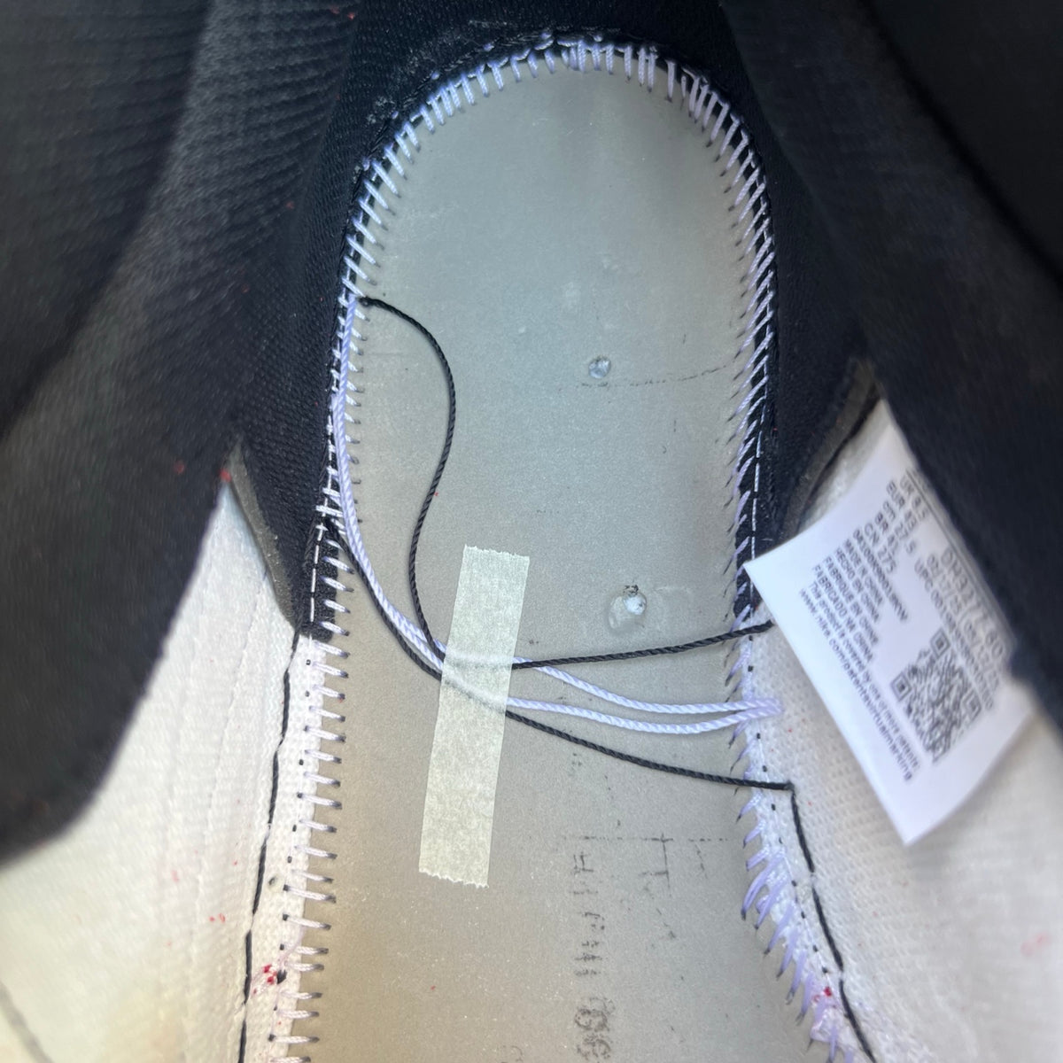 Nike Air Jordan 1 Retro High OG SP Fragment x Travis Scott sneakers in white and brown with Nike swoosh and Travis Scott branding.