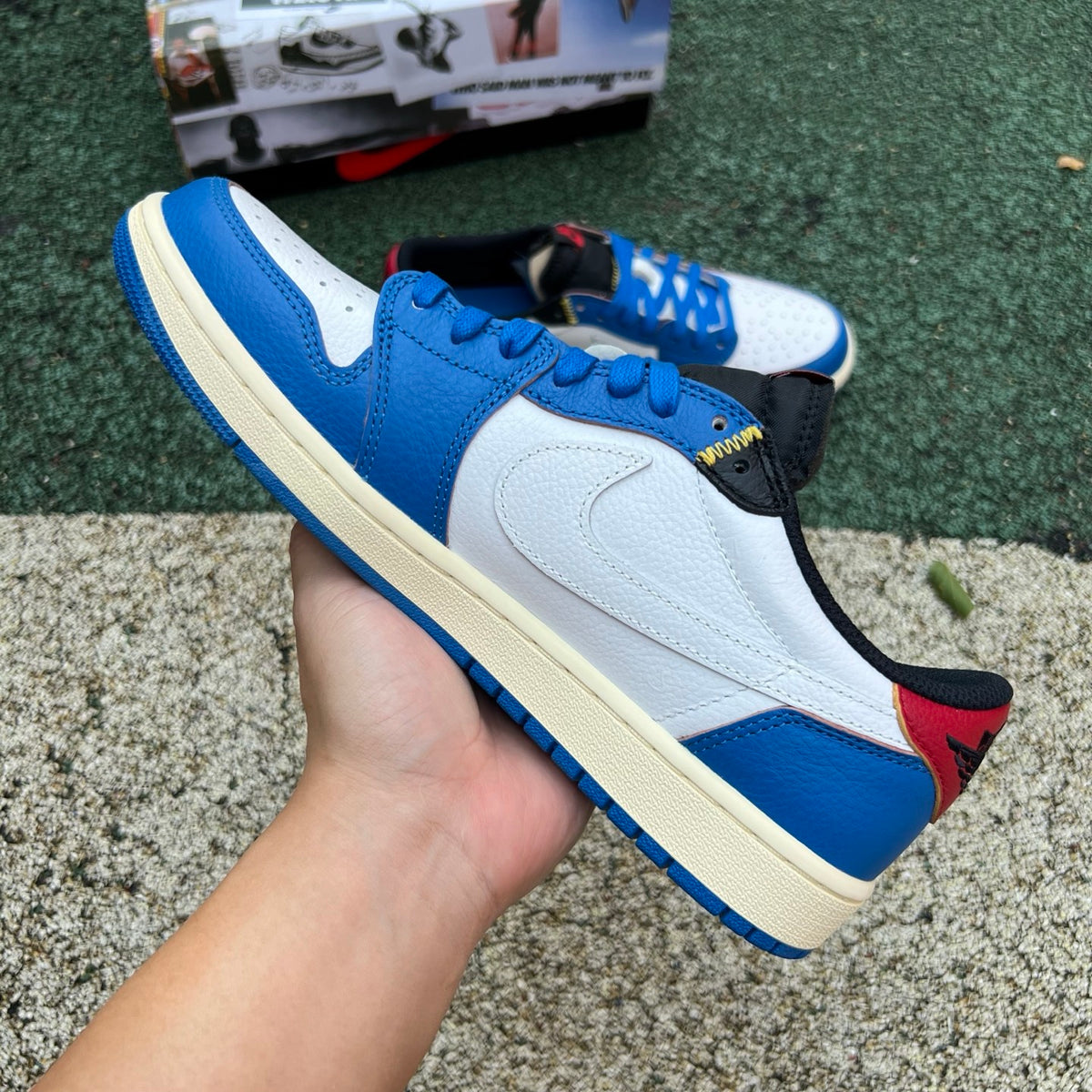 Nike Air Jordan 1 Retro Low OG SP Union LA x Travis Scott sneaker in white and brown leather with Nike and Jordan branding.