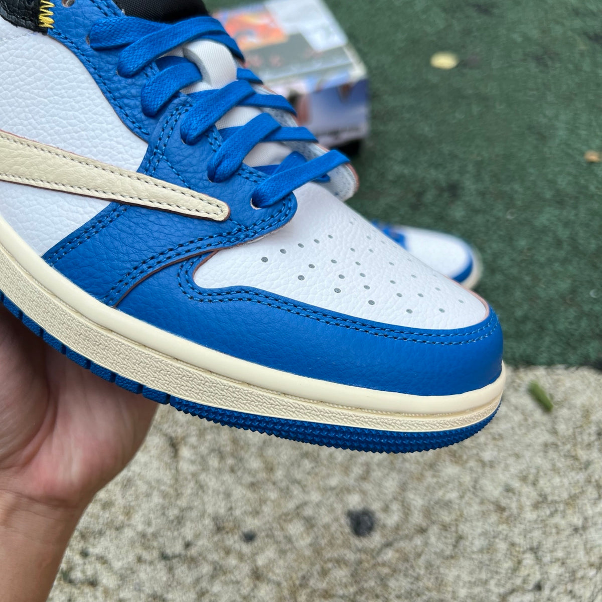 Nike Air Jordan 1 Retro Low OG SP Union LA x Travis Scott sneakers in black and brown colorway, featuring Nike and Jordan branding.