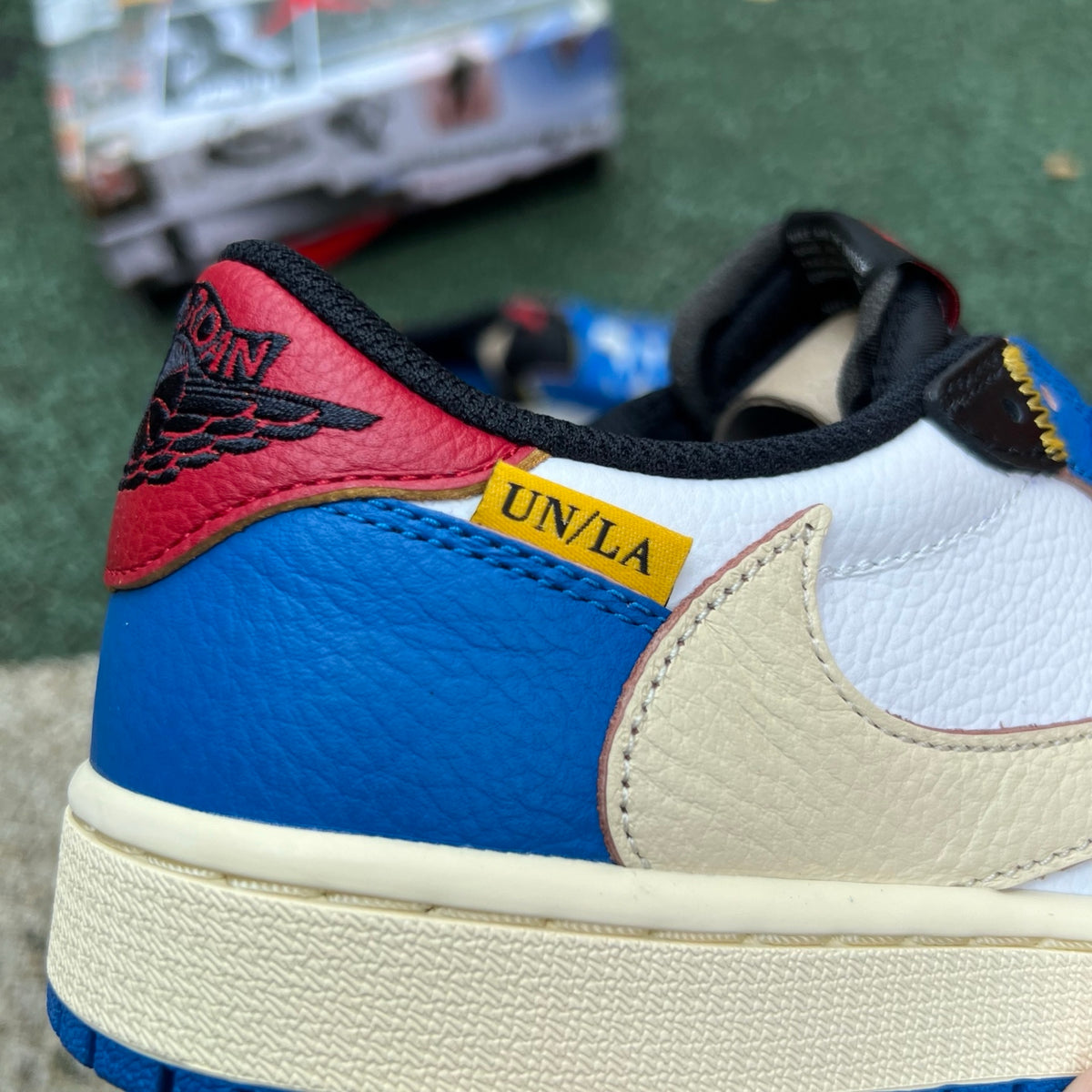 Nike Air Jordan 1 Retro Low OG SP Union LA x Travis Scott sneaker, featuring black and red colorway with signature design details.