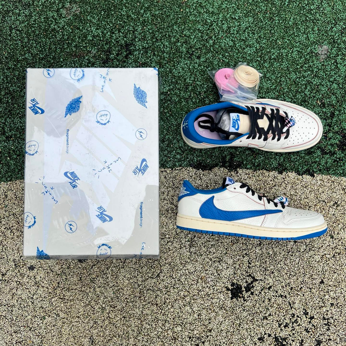 Nike Air Jordan 1 Retro Low OG SP Fragment x Travis Scott sneakers in Sail and Military Blue, showcasing the collaboration design.