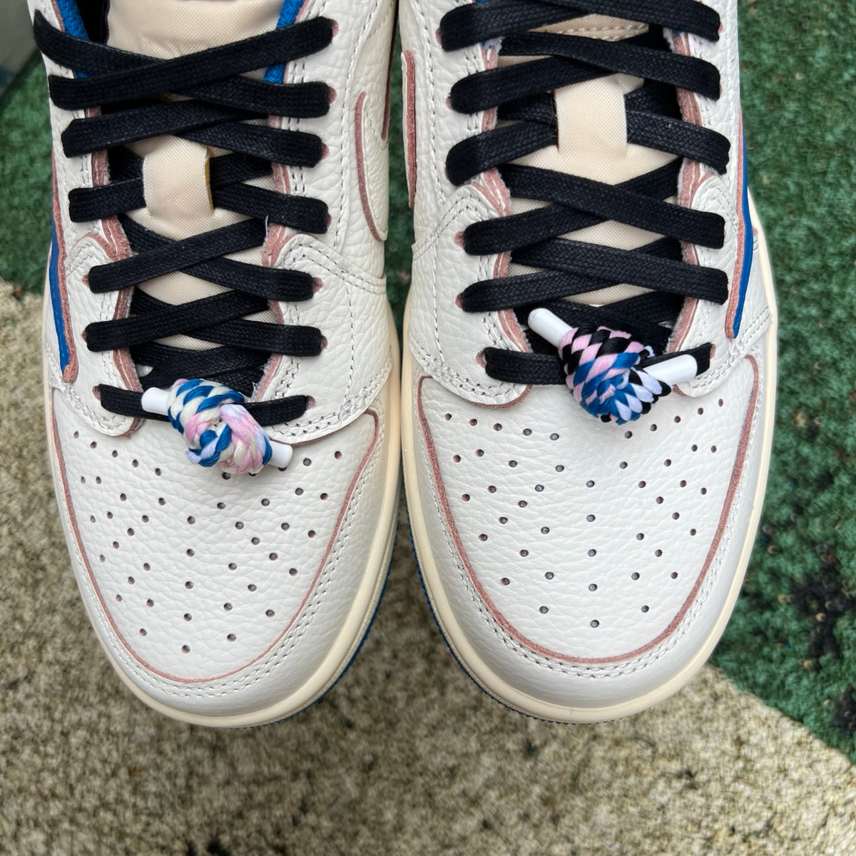 Nike Air Jordan 1 Retro Low OG SP Fragment x Travis Scott sneakers in Sail and Military Blue with signature design details.