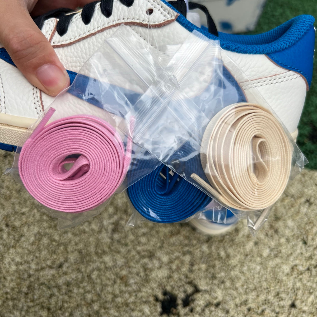 Nike Air Jordan 1 Retro Low OG SP Fragment x Travis Scott sneakers in Sail and Military Blue, side view showing design details
