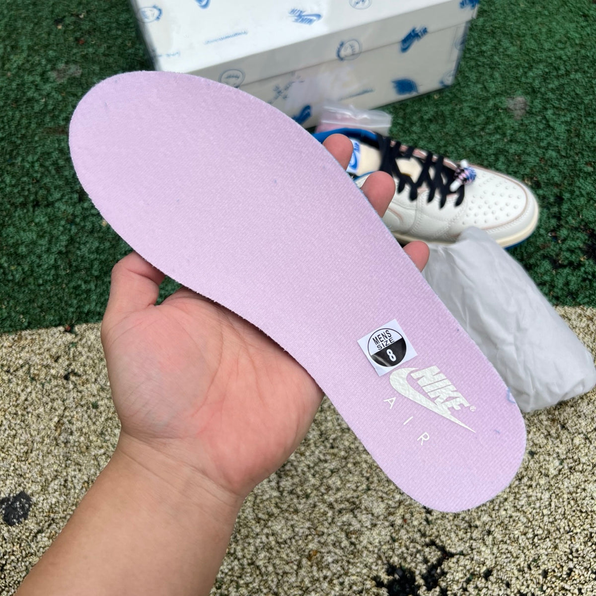 Nike Air Jordan 1 Retro Low OG SP Fragment x Travis Scott sneakers in Sail and Military Blue, featuring Nike and Jordan branding.