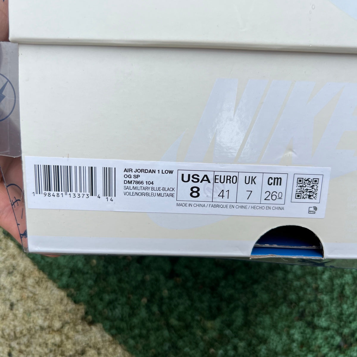Nike Air Jordan 1 Retro Low OG SP Fragment x Travis Scott sneakers in Sail and Military Blue, featuring signature design details.