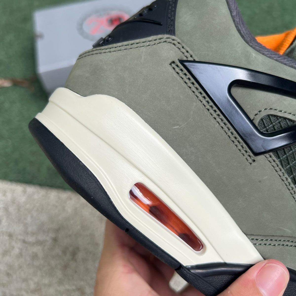 Nike Air Jordan 4 Retro OG SP Undefeated sneakers in white and black with signature branding and stylish design.