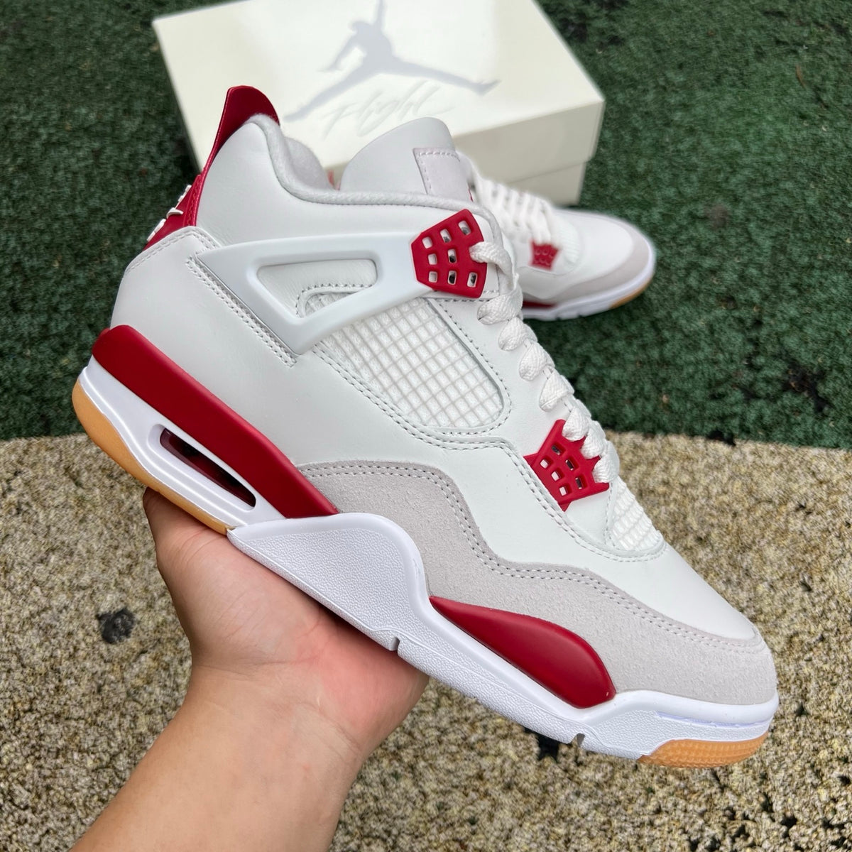 Nike Air Jordan 4 Retro SB Varsity Red sneakers, classic basketball shoe with red and black colorway, detailed side view.