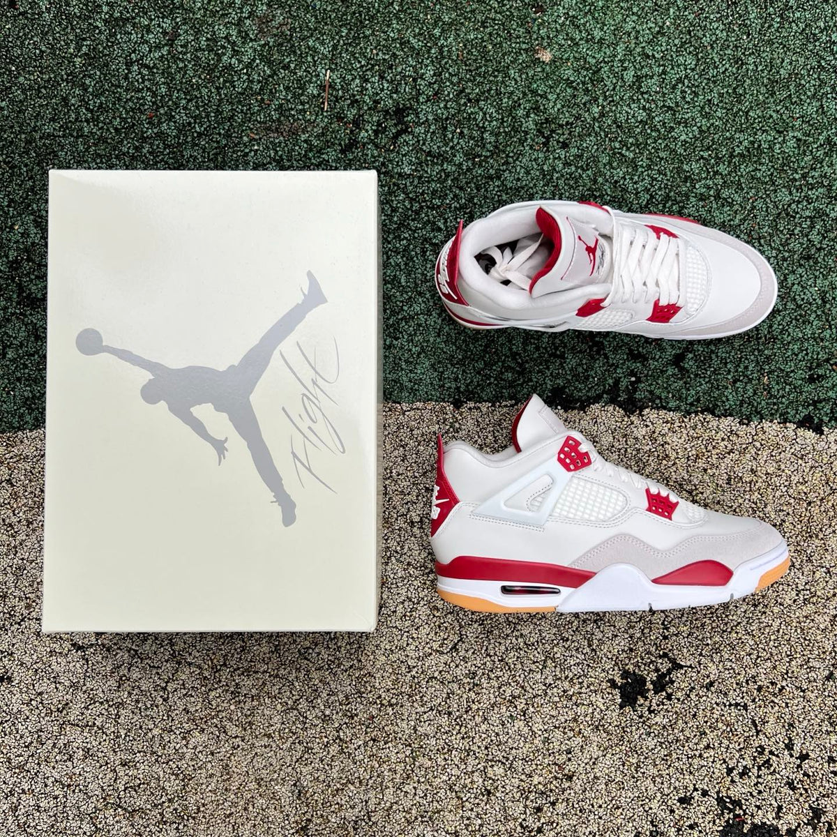 Nike Air Jordan 4 Retro SB Varsity Red sneakers, featuring red and black colorway, with textured leather and classic Jordan design.