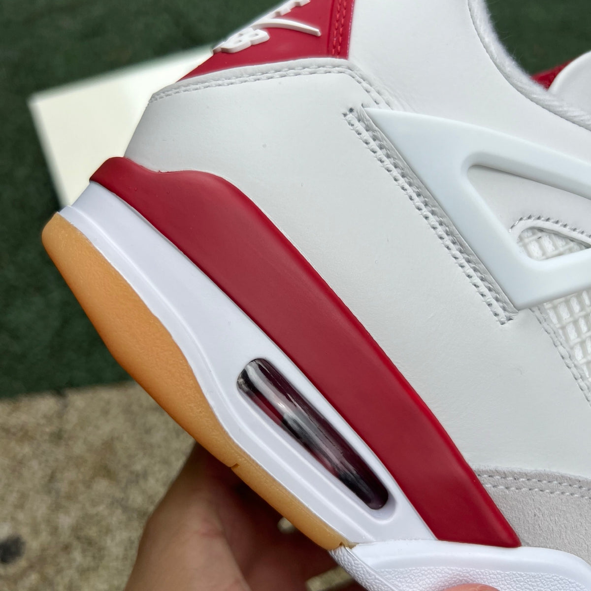 Nike Air Jordan 4 Retro SB Varsity Red sneaker, featuring red and black colorway with Nike x Jordan branding and classic design details.