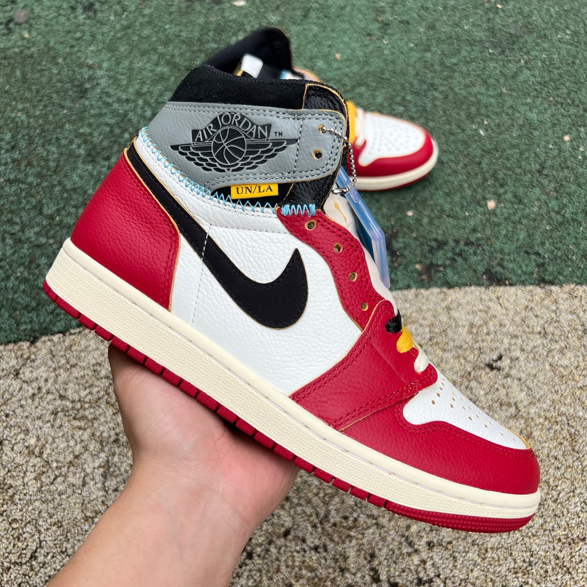 Nike Air Jordan 1 Retro High OG SP Union LA Chicago Shadow sneakers, featuring a high-top design with black, red, and grey color accents.