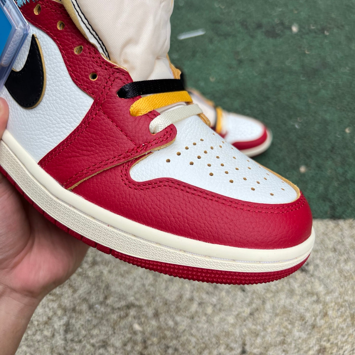 Nike Air Jordan 1 Retro High OG SP Union LA Chicago Shadow sneakers, featuring black, red, and grey colorways with classic high-top design.