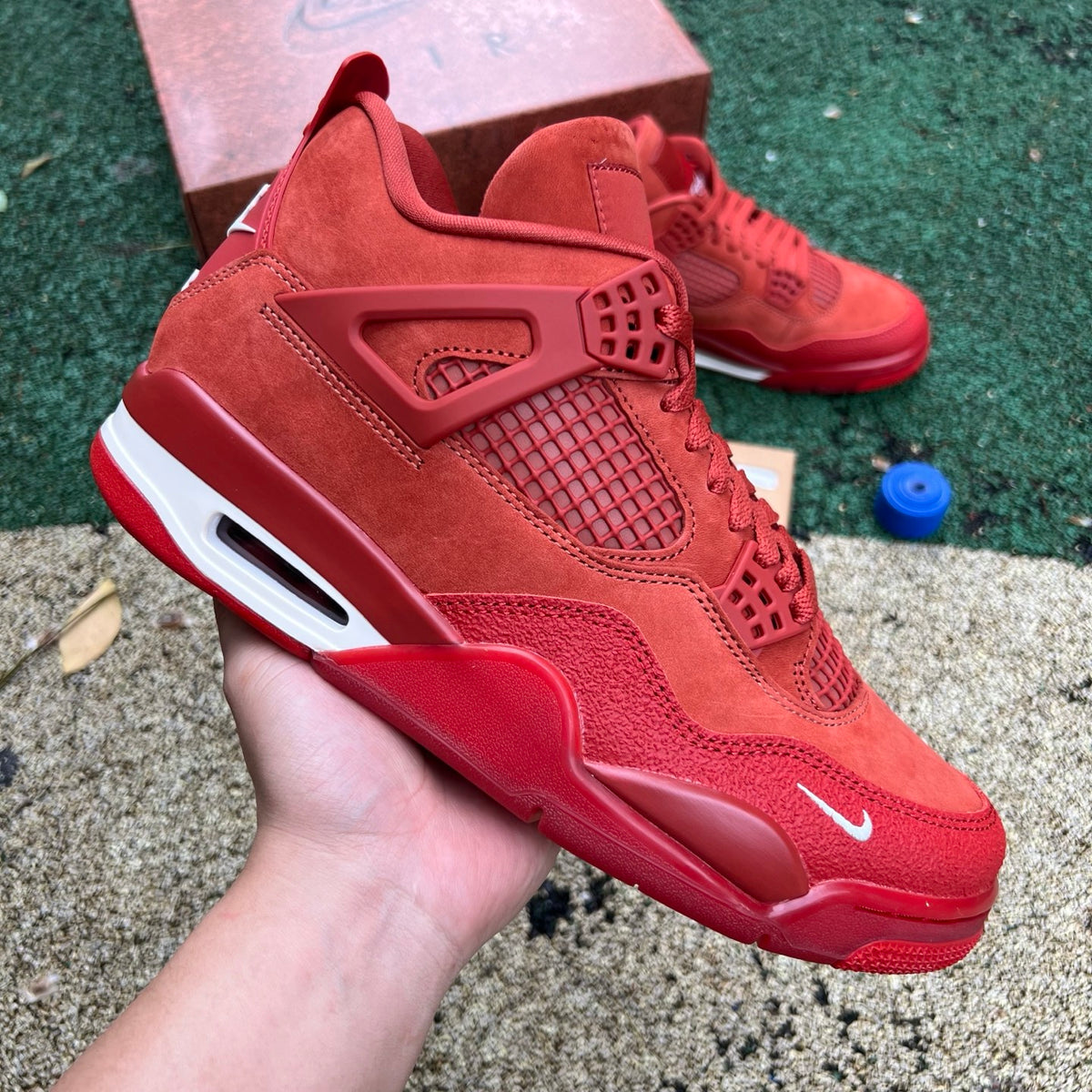 Nike Air Jordan 4 Retro OG SP Nigel Sylvester Brick by Brick sneakers in white and red, featuring detailed brick-like design elements.