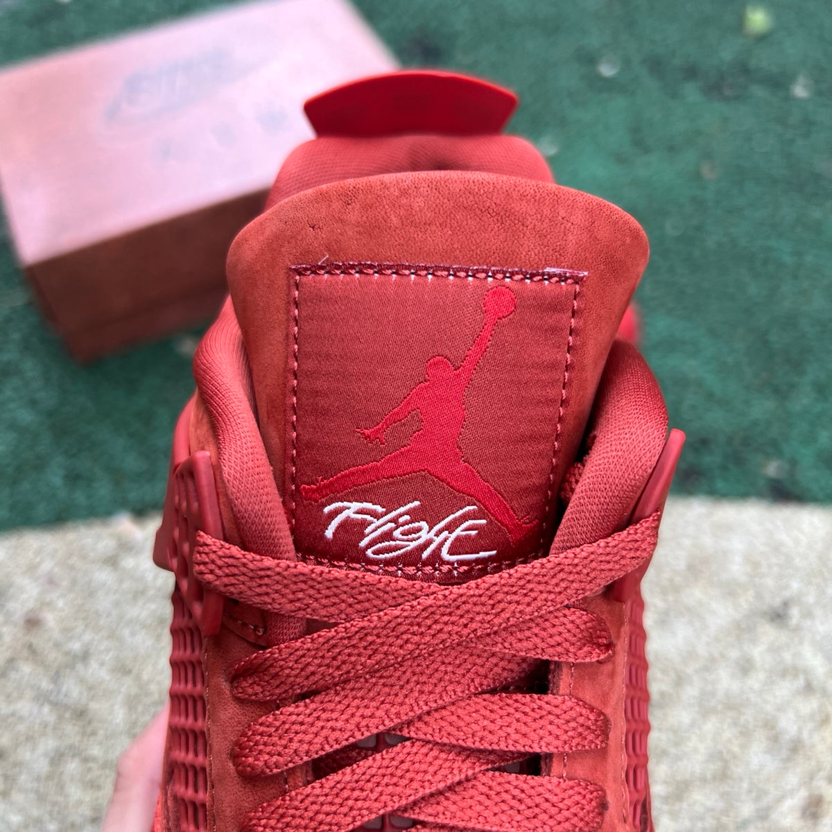 Nike Air Jordan 4 Retro OG SP Nigel Sylvester Brick by Brick sneaker in white and red with detailed design elements.