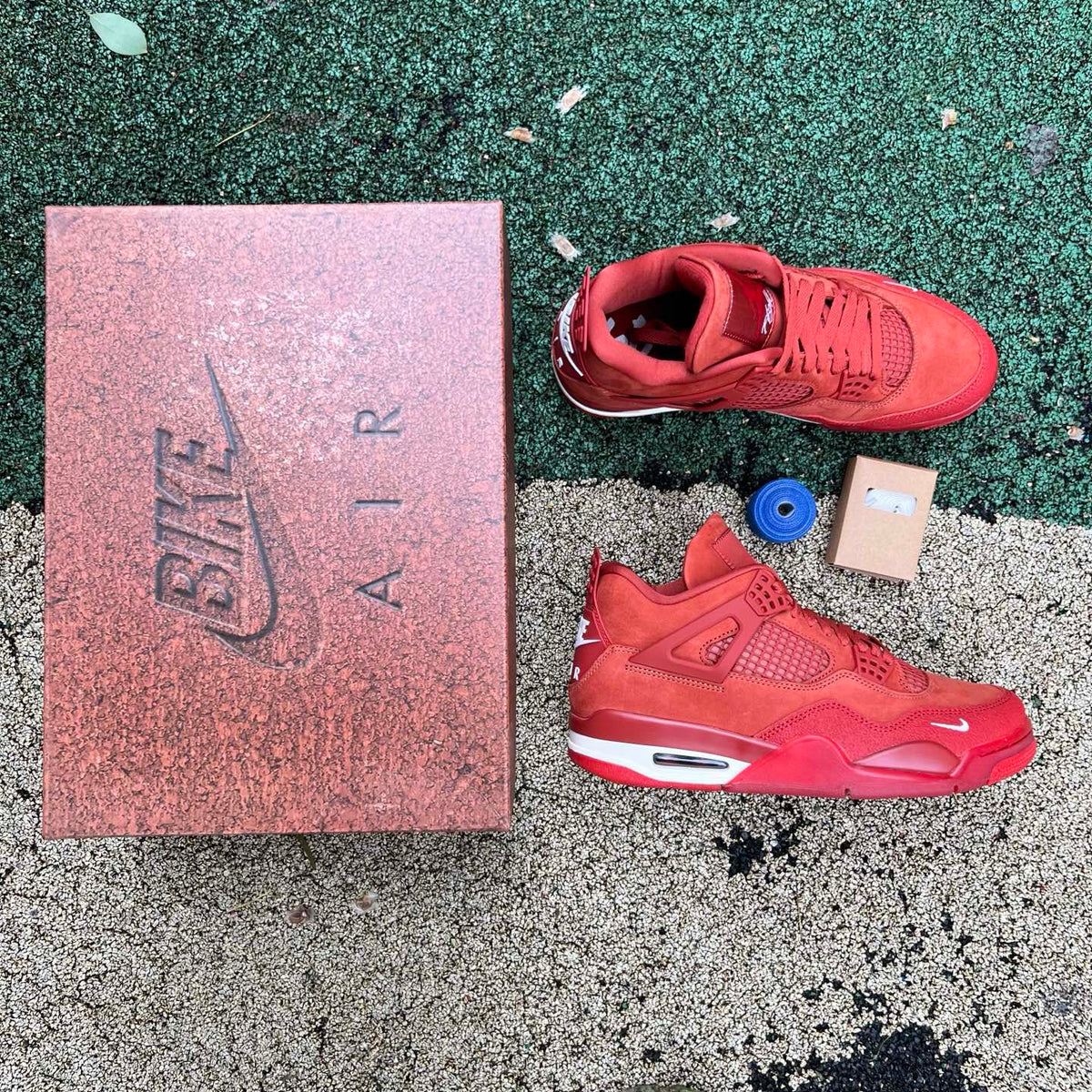 Nike Air Jordan 4 Retro OG SP Nigel Sylvester Brick by Brick sneakers in white and red with detailed design elements.