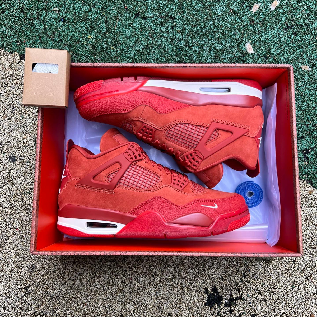 Nike Air Jordan 4 Retro OG SP Nigel Sylvester Brick by Brick sneaker in black and red, featuring iconic design details.