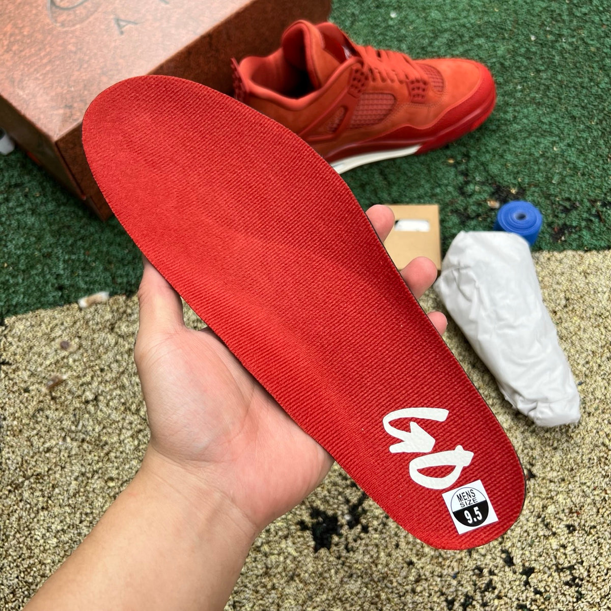 Nike Air Jordan 4 Retro OG SP Nigel Sylvester Brick by Brick sneakers, grey and red colorway, showcasing the signature design details.
