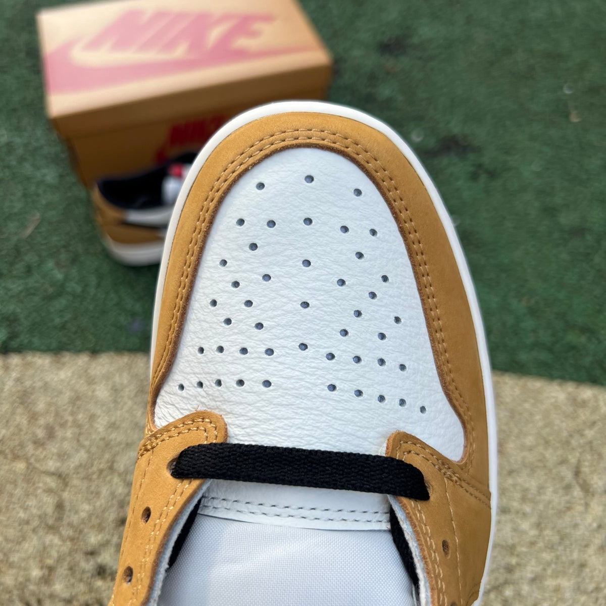 Nike Air Jordan 1 Low OG Rookie of the Year sneakers, black and white colorway, featuring iconic Jordan branding and low-top design.